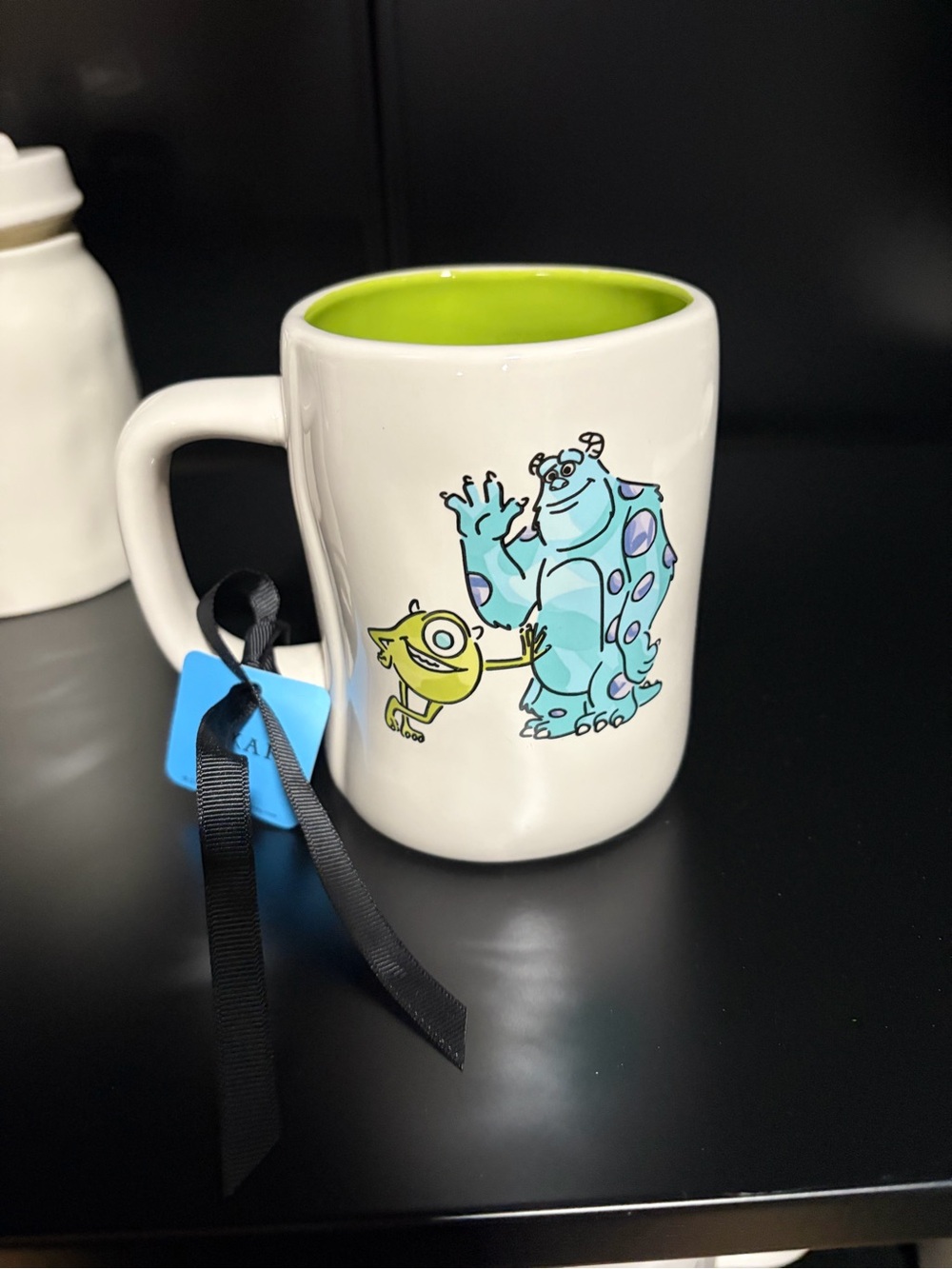 Rae Dunn White Mug with Green Interior and Monsters Design